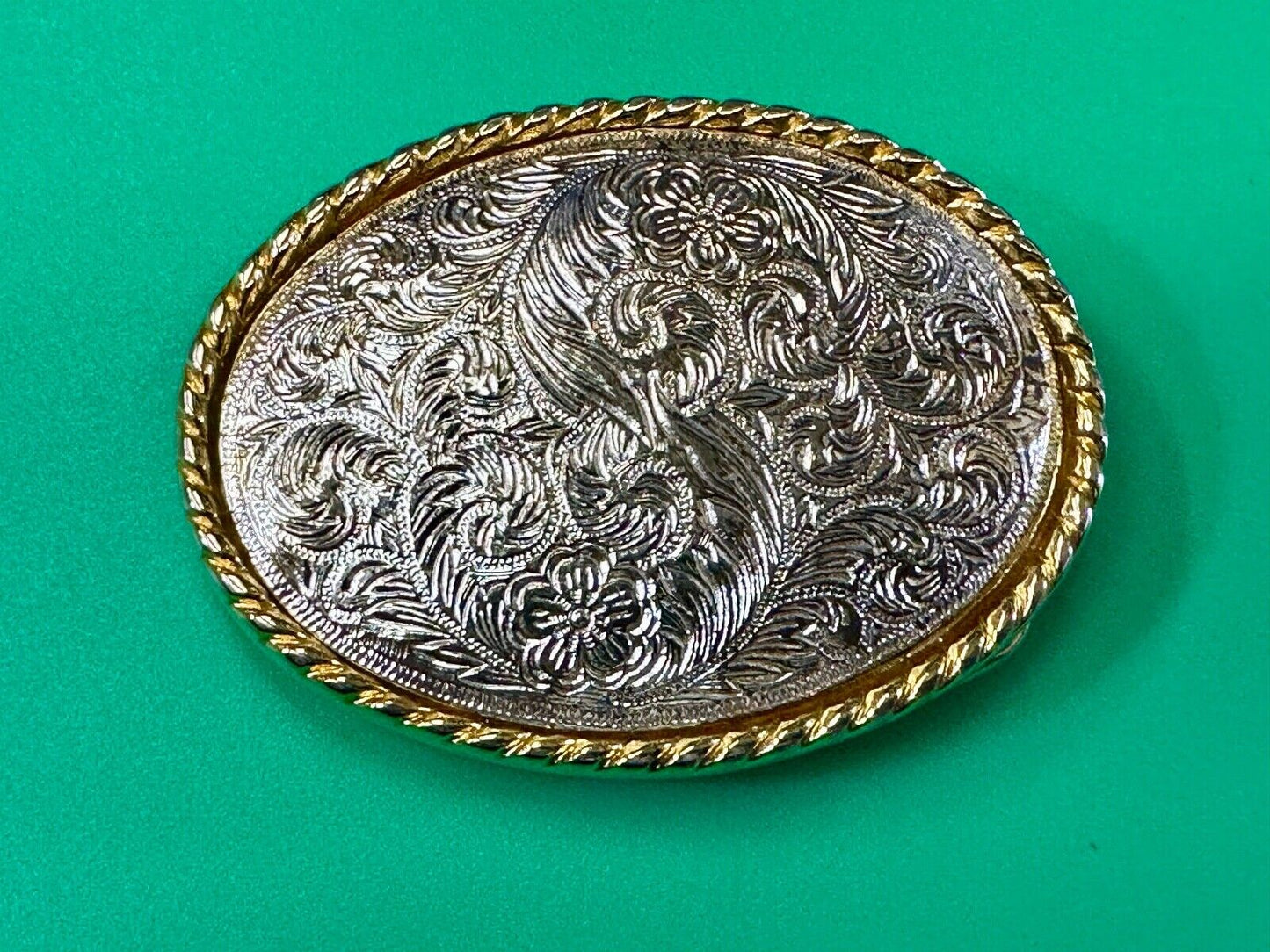 vintage Ivan Brand western flower swirl design two tone oval belt buckle