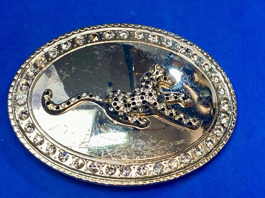 A big Tiger Cat running featured on western oval belt buckle 