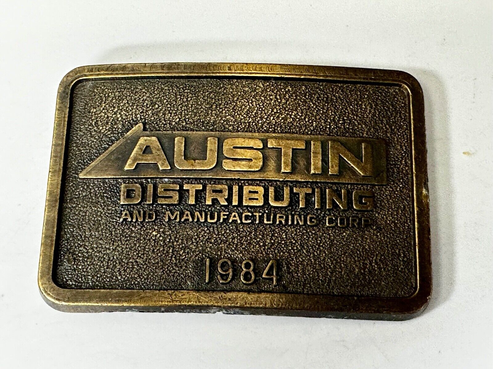Austin Texas Distributing and Manufacturing 1984 Advertisement Promo Belt Buckle
