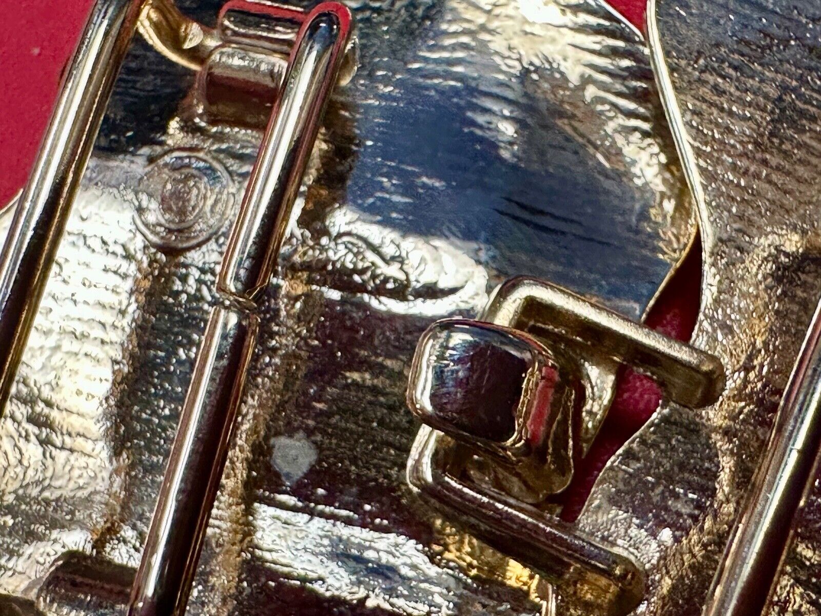 Two-piece interlocking gold tone leaf swirl theme belt slide buckle signed _____
