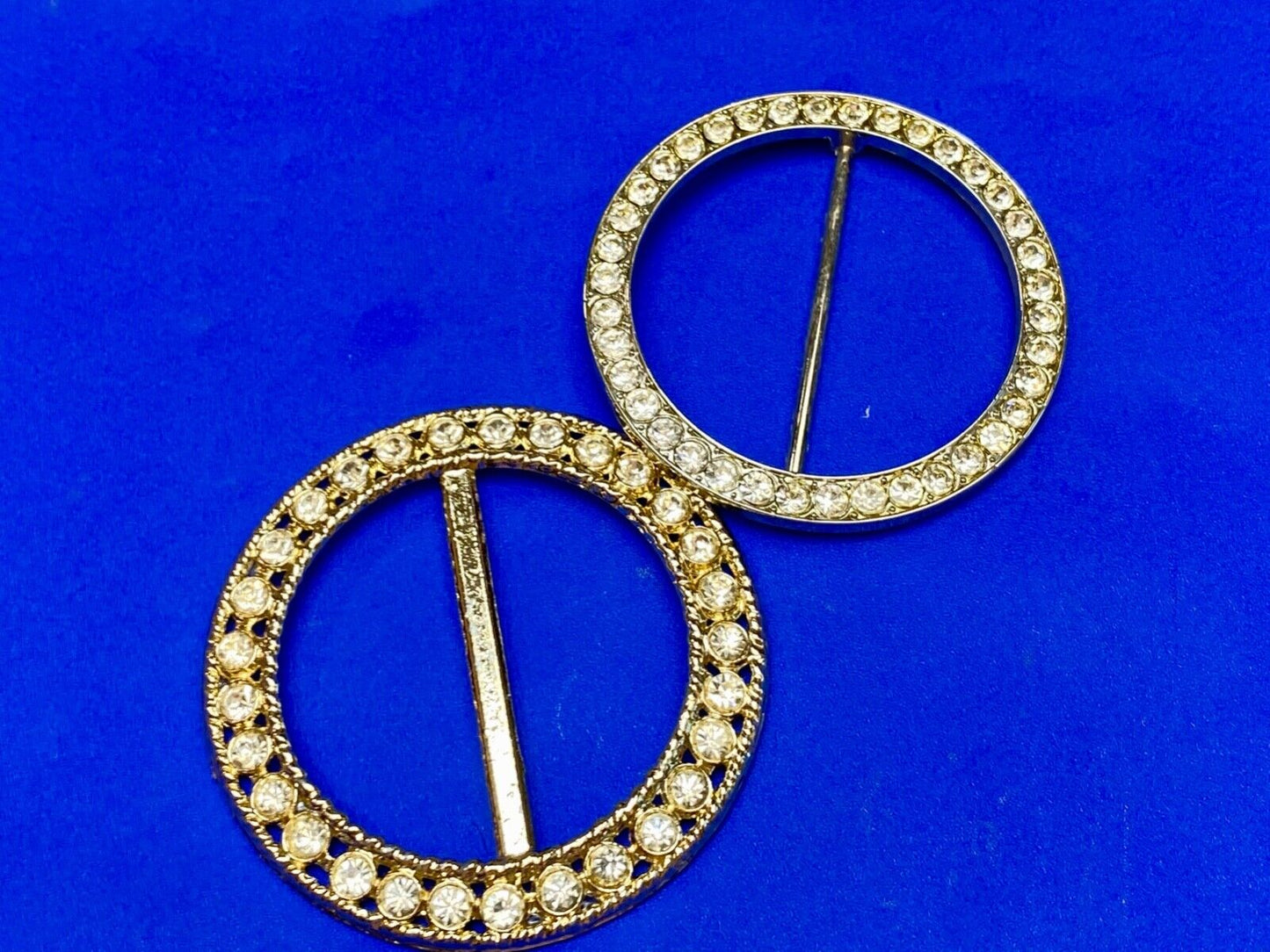 Two piece lot of antique Rhinestone covered round scarf slides