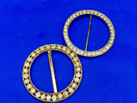 Two piece lot of antique Rhinestone covered round scarf slides