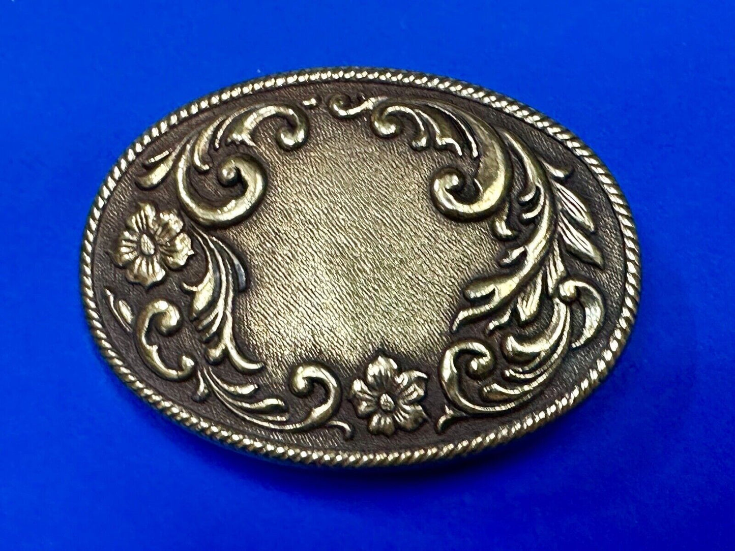 USA made vintage western flower swirl design oval belt buckle marked W