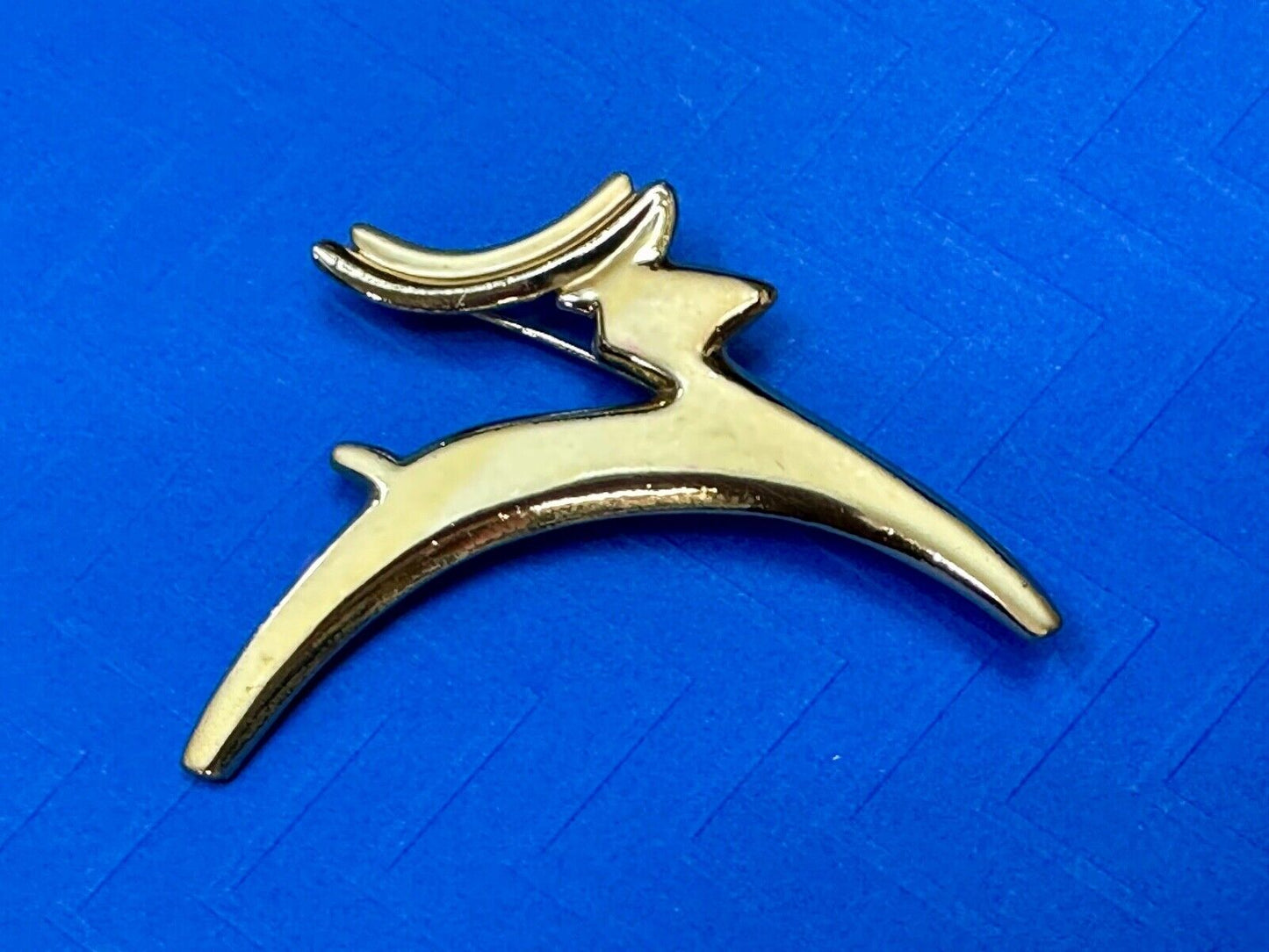 Abstract gold tone running deer - Vintage Christmas Holliday Brooch by AJC