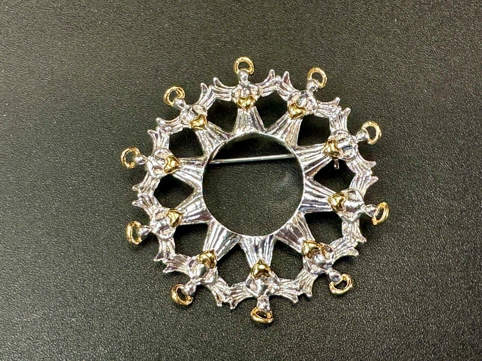 Angles in Circular pattern holiday wreath Avon signed vintage brooch pin