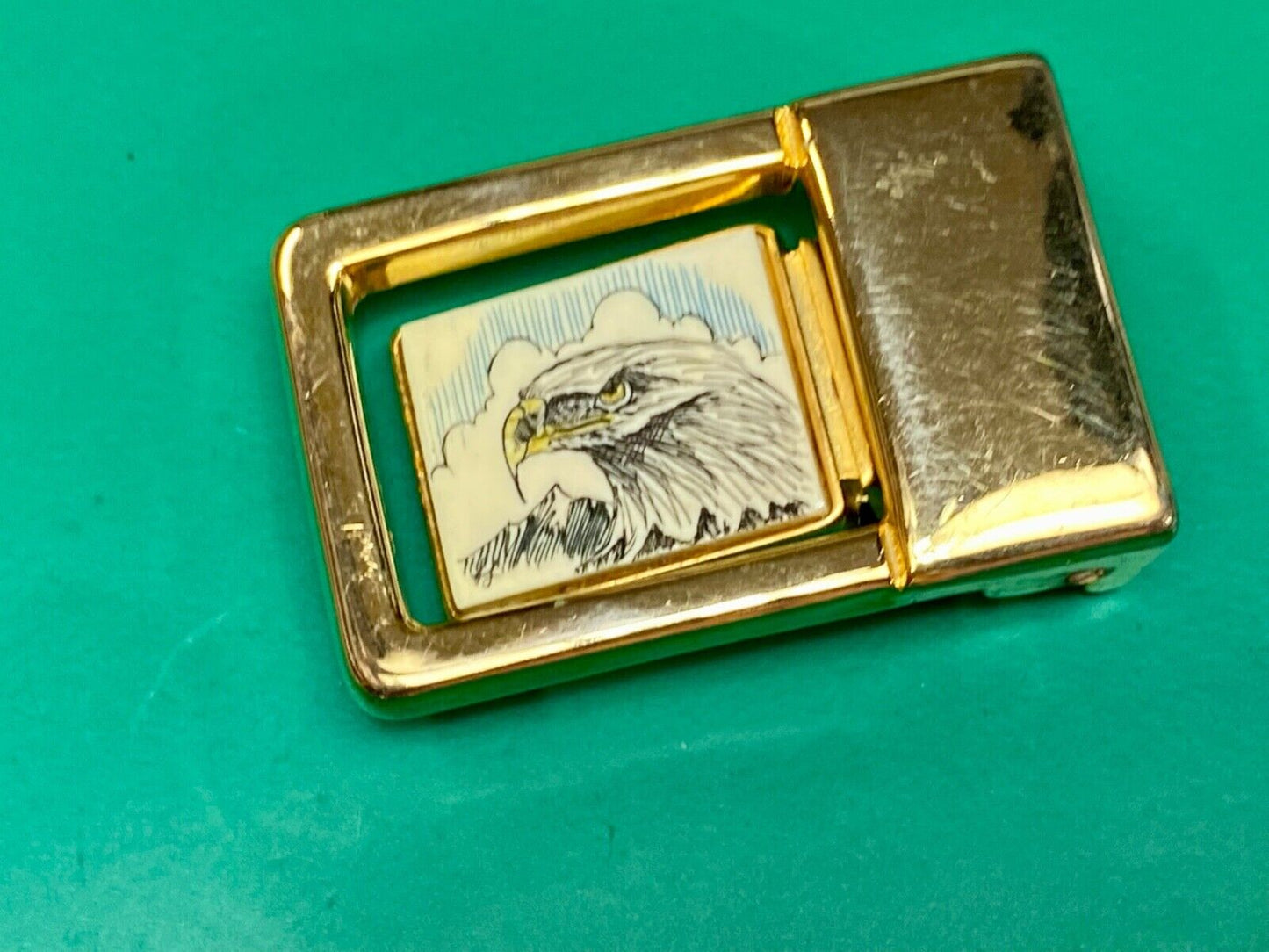 Patriotic American bald Eagle head on small brass or gold color belt buckle