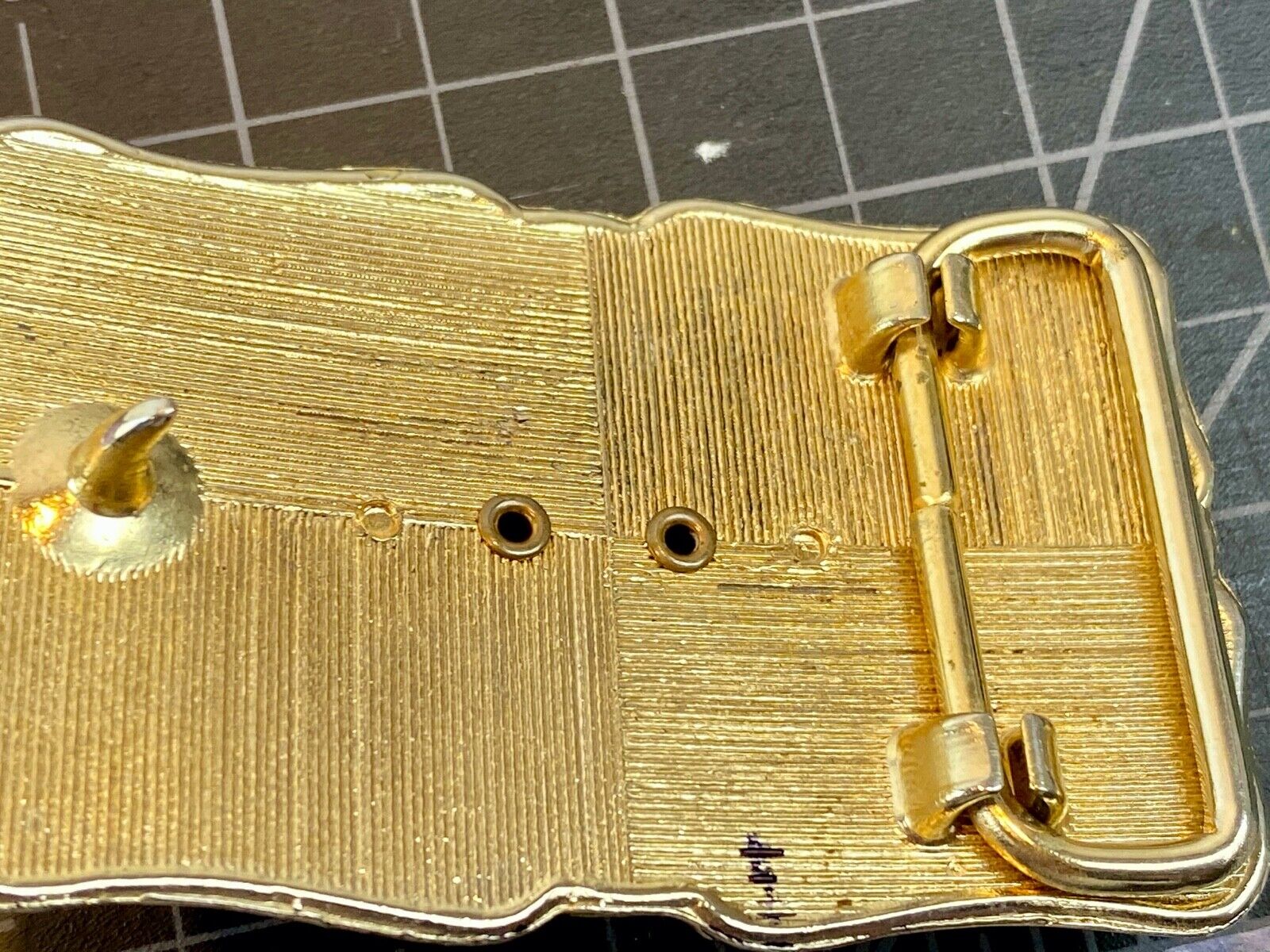 unknown multi layered colored stone as centerpiece in western belt buckle