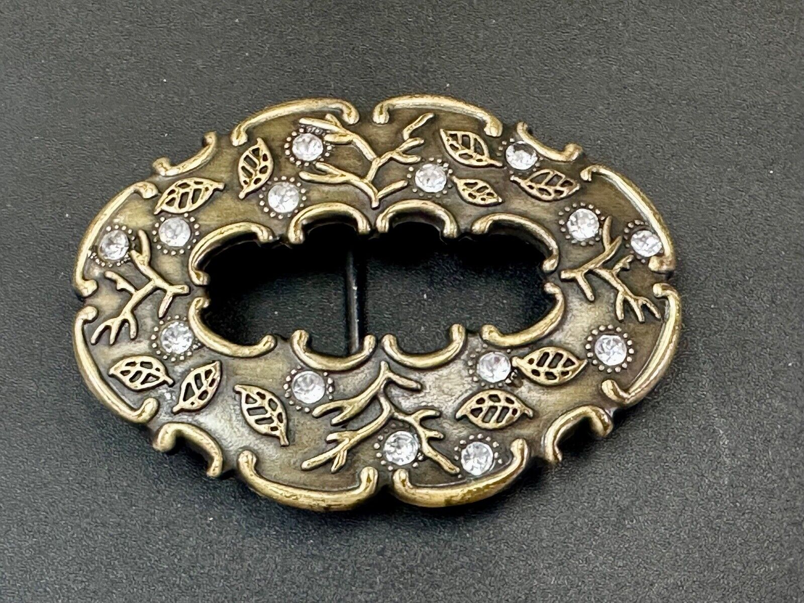 3" wide brown rhinestone accented leaf pattern semi oval belt buckle
