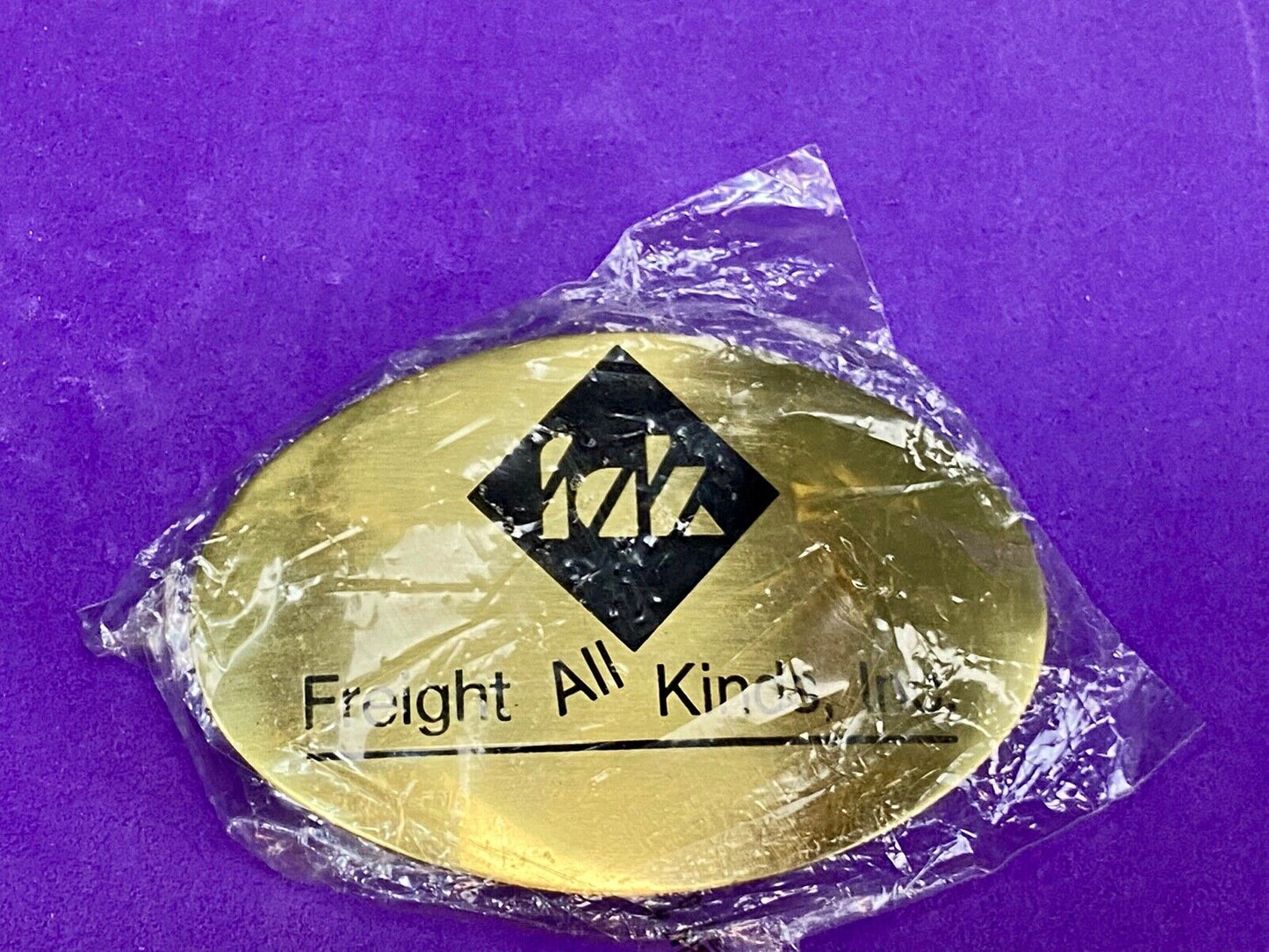 Vintage Freight all kinds, INC. promotional brass belt buckle 