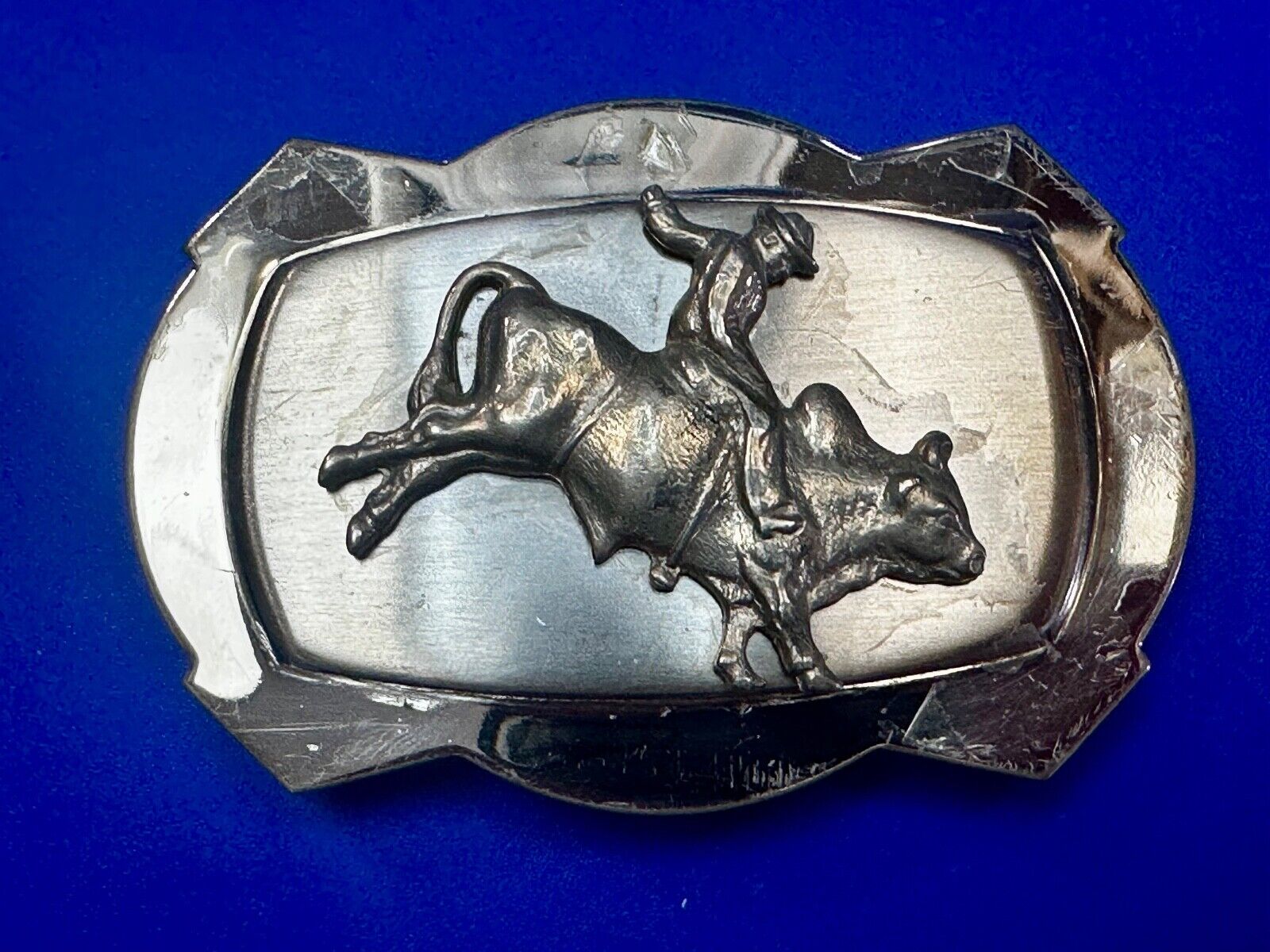 Vintage Cowboy Saddle Bronc on reflective two tone western belt buckle