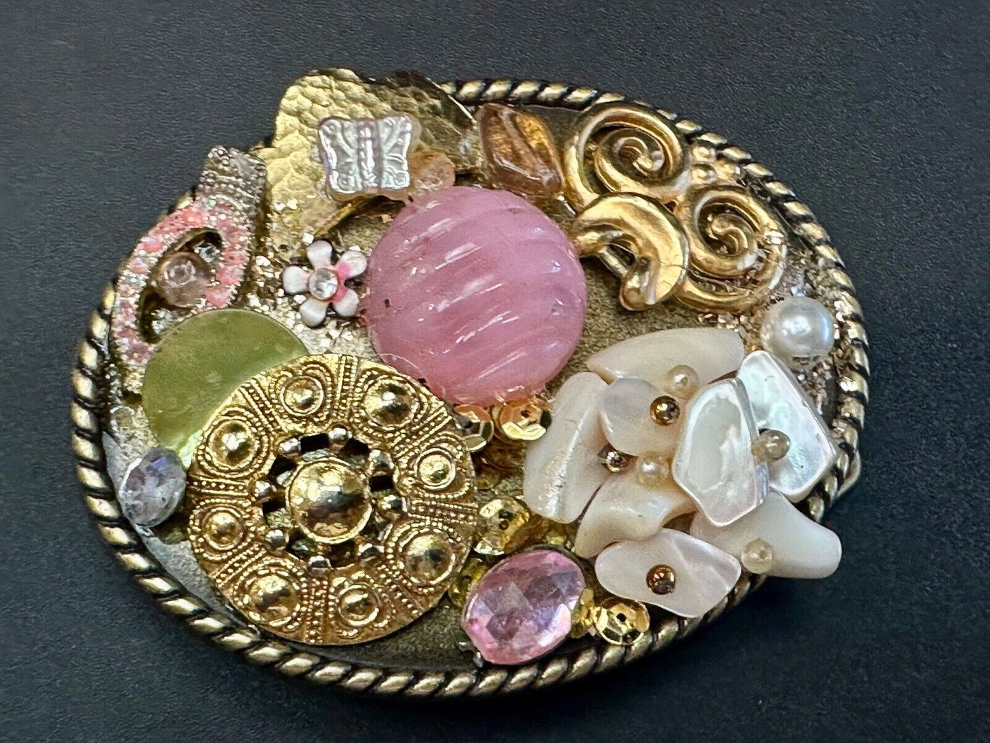Artisan Abstract flowers made of mixed material on gold tone oval belt buckle