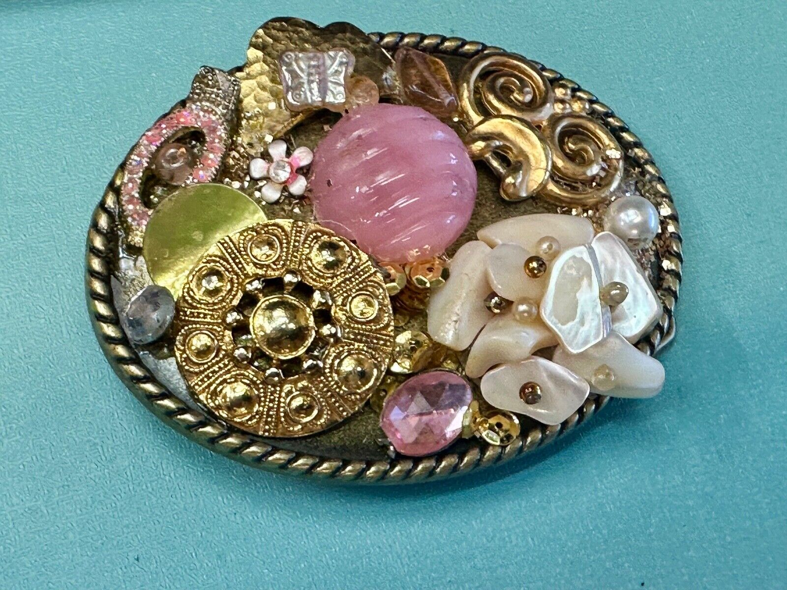Artisan Abstract flowers made of mixed material on gold tone oval belt buckle