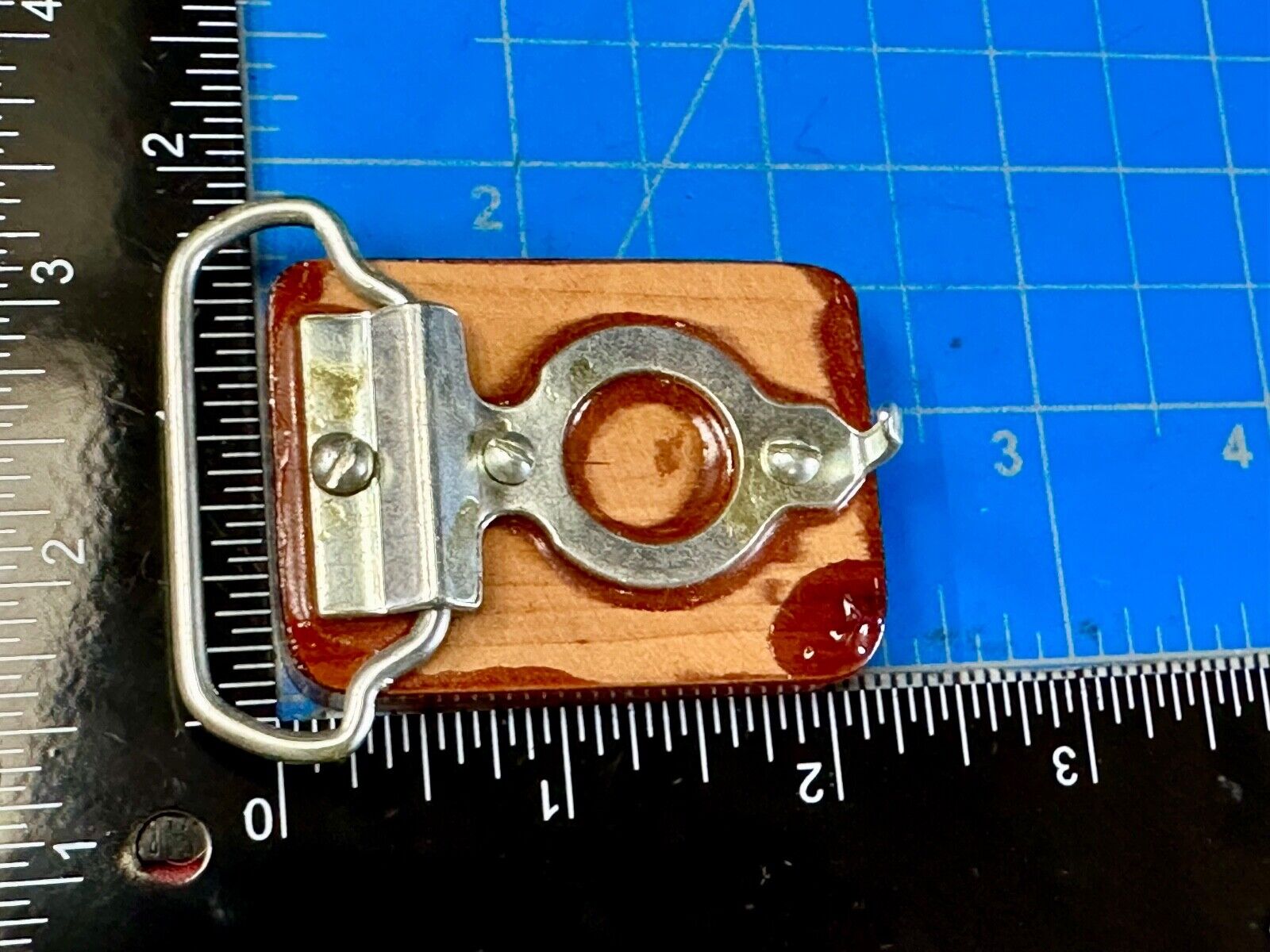 Artisan wood belt buckle with inlaid Luary Caverns cave token coin