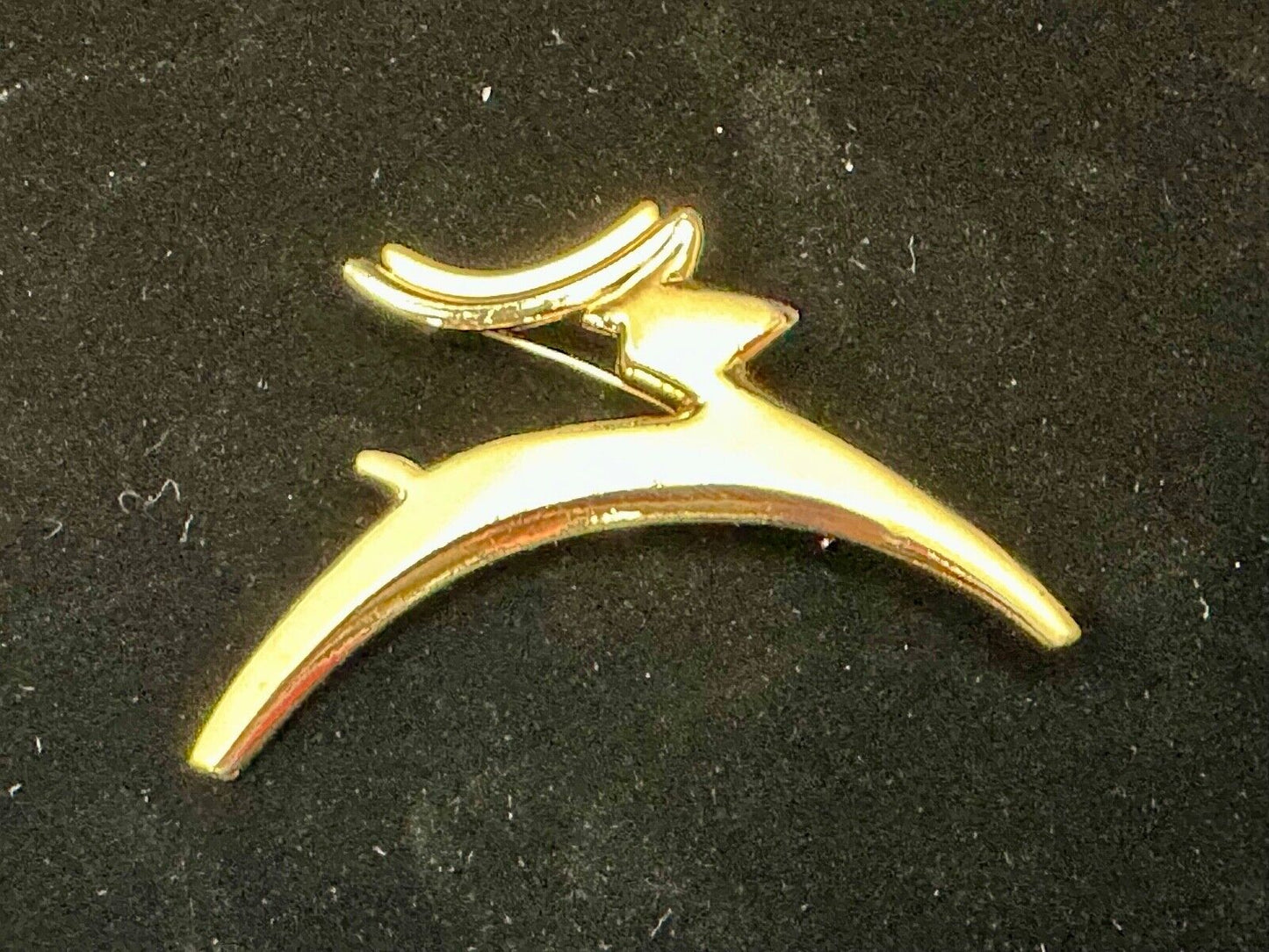 Abstract gold tone running deer - Vintage Christmas Holliday Brooch by AJC