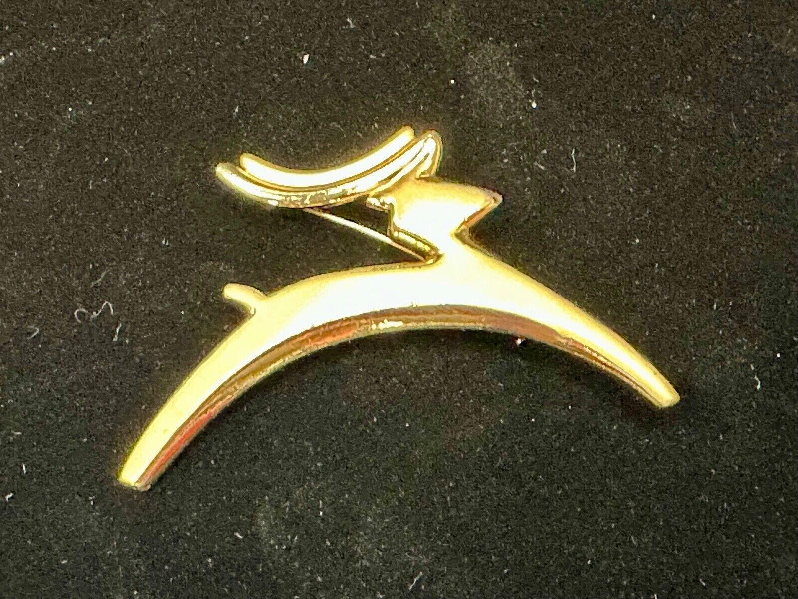 Abstract gold tone running deer - Vintage Christmas Holliday Brooch by AJC