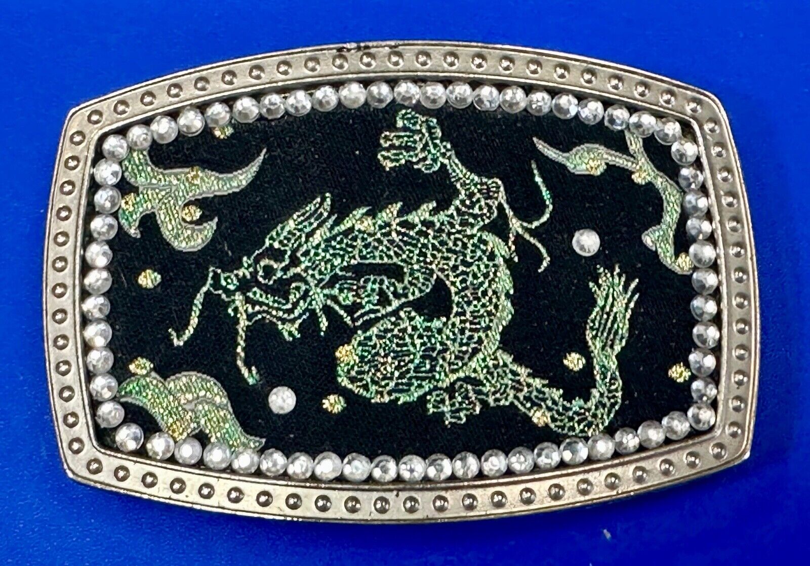 Chinese Dragon pattern symbol on silver tone rhinestone accented belt buckle