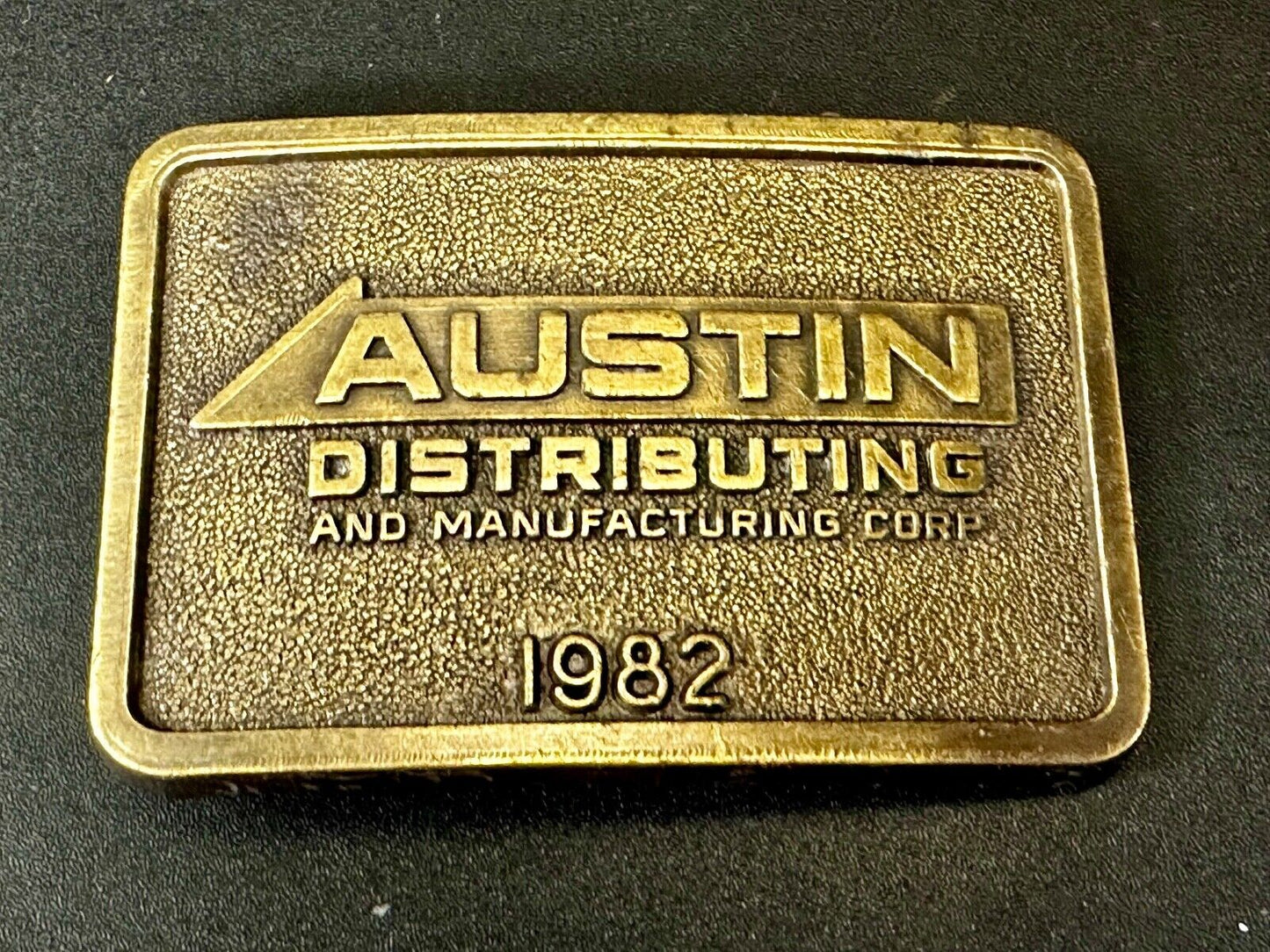 Austin Texas Distributing and Manufacturing 1982 Advertisement Promo Belt Buckle
