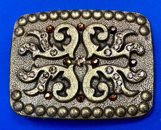 unique rhinestone accented swirl pattern on rounded rectangular belt buckle