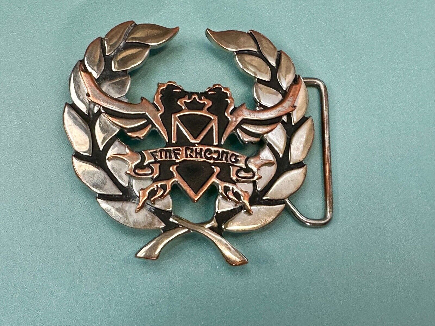 Two griffins?  FME RheJNG Olive branch cutout belt buckle