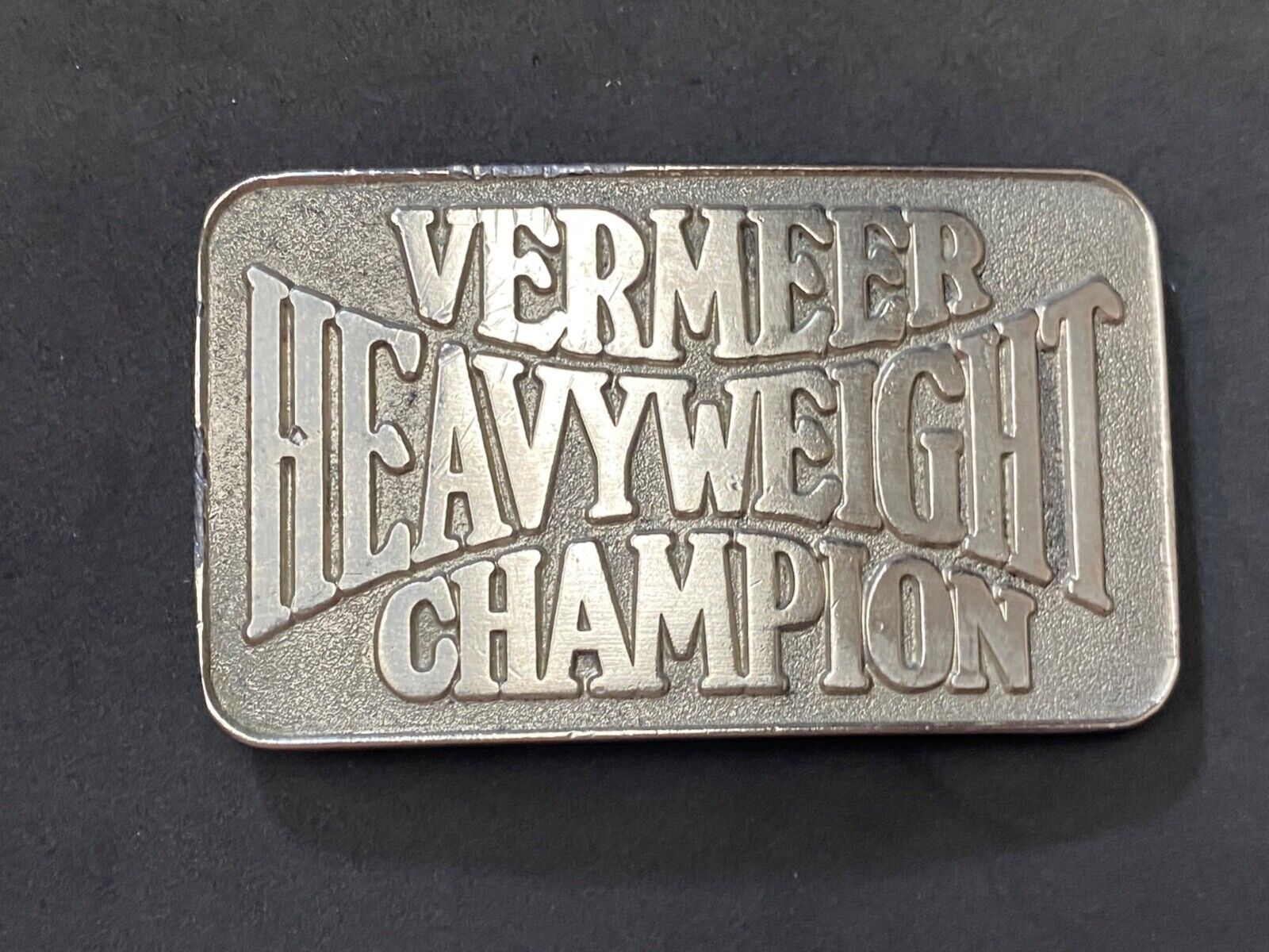 Vermeer Heavyweight Champion Belt Buckle by Spec Cast