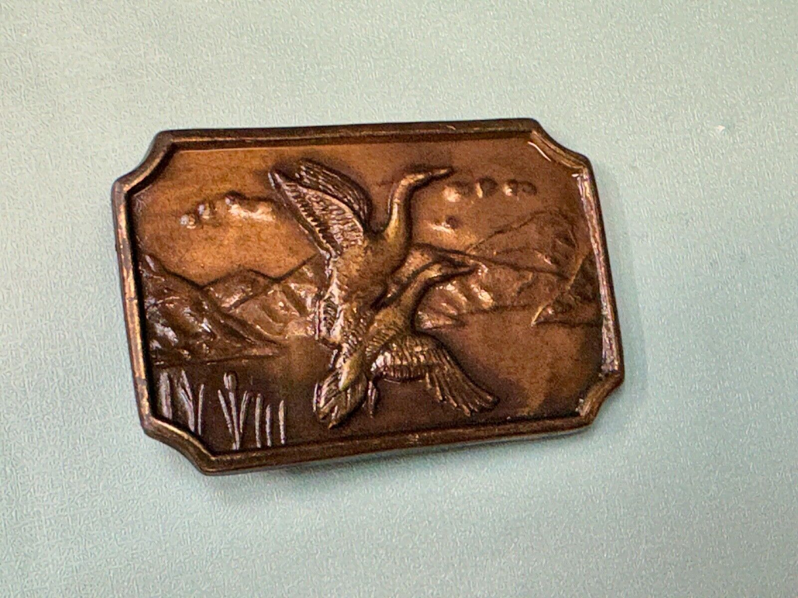 Two ducks flying from pond - Vintage nature scene belt buckle