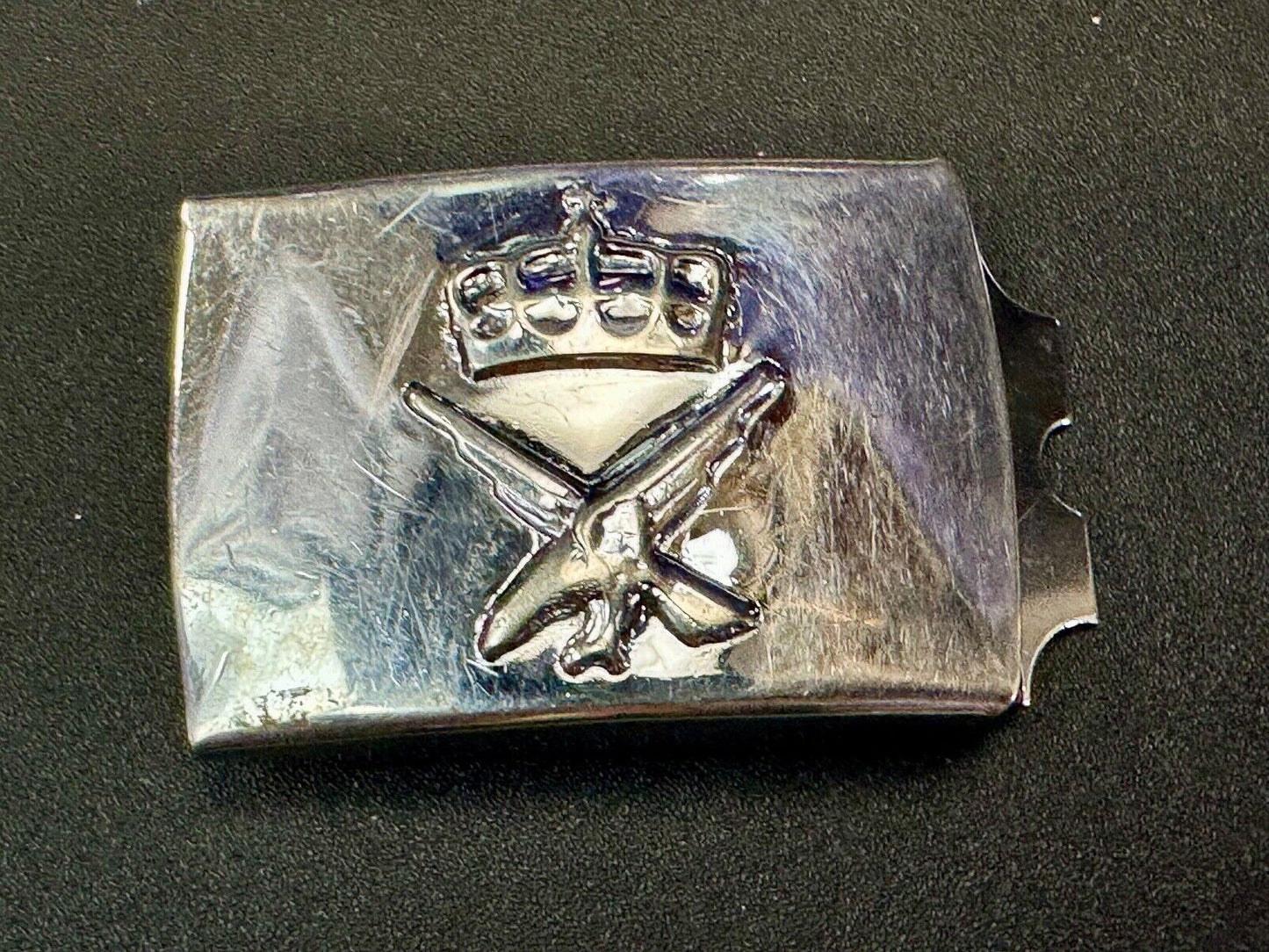 unknown to me!   dress style silver tone crown X crest? stamped belt buckle