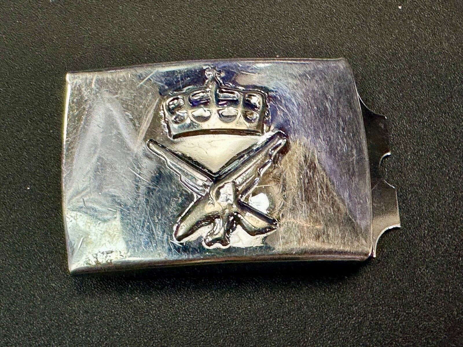 unknown to me!   dress style silver tone crown X crest? stamped belt buckle