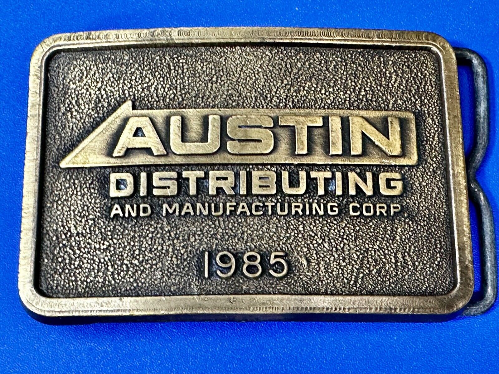 Austin Texas Distributing and Manufacturing 1985 Advertisement Promo Belt Buckle
