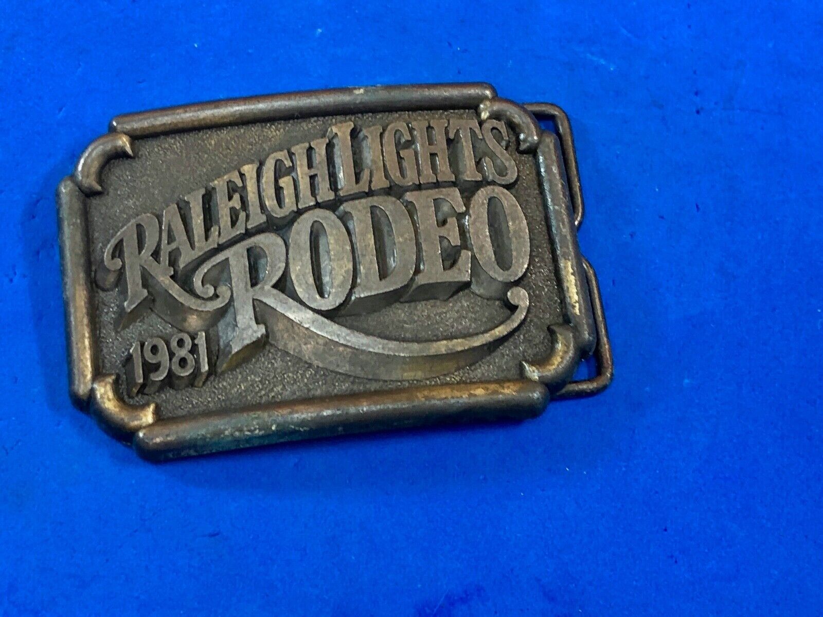  BELT BUCKLE, " RALEIGH LIGHTS RODEO   Cigarette company sponsored event 