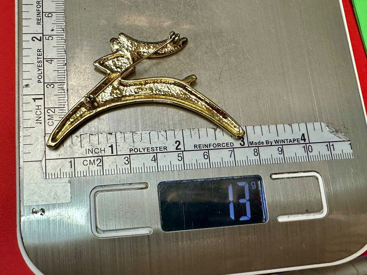 Abstract gold tone running deer - Vintage Christmas Holliday Brooch by AJC