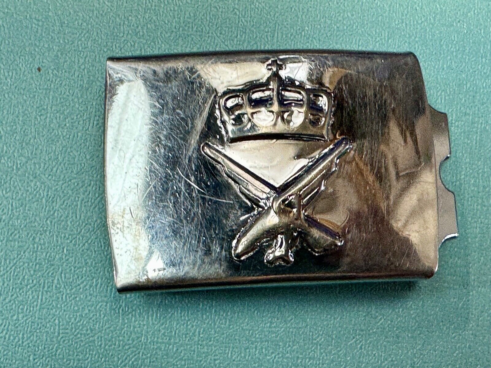 unknown to me!   dress style silver tone crown X crest? stamped belt buckle