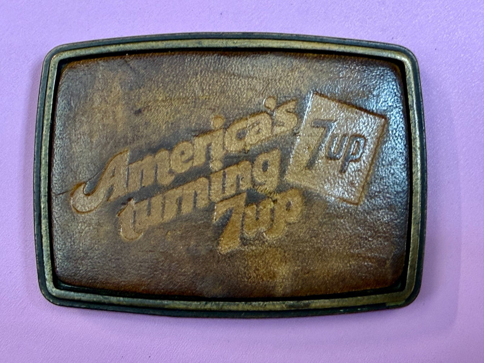 America's Turning 7up Embossed Leather on Metal Advertising Promo Belt Buckle