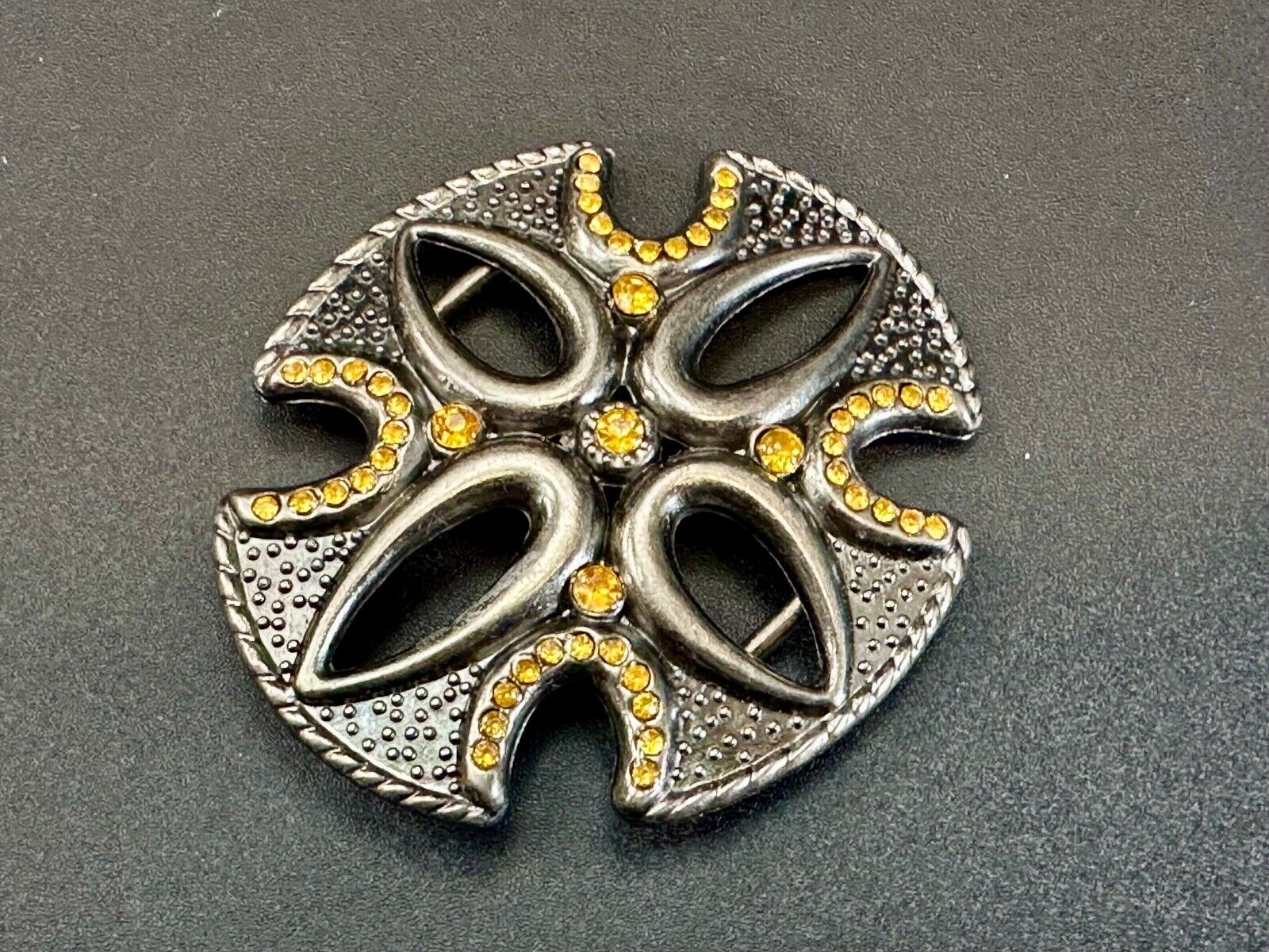 unique see through iron cross with golden brown rhinestone accents