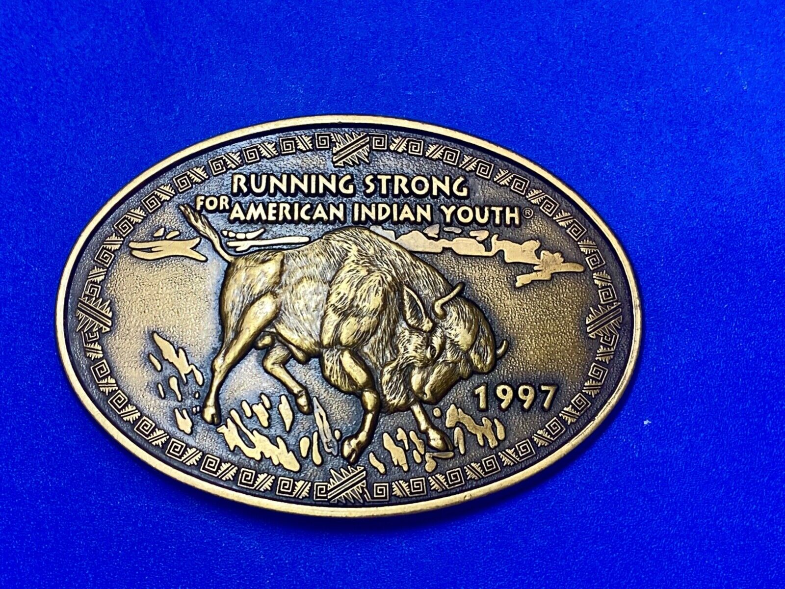 Vintage 1997 BUFFALO belt buckle RUNNING STRONG FOR AMERICAN INDIAN YOUTH