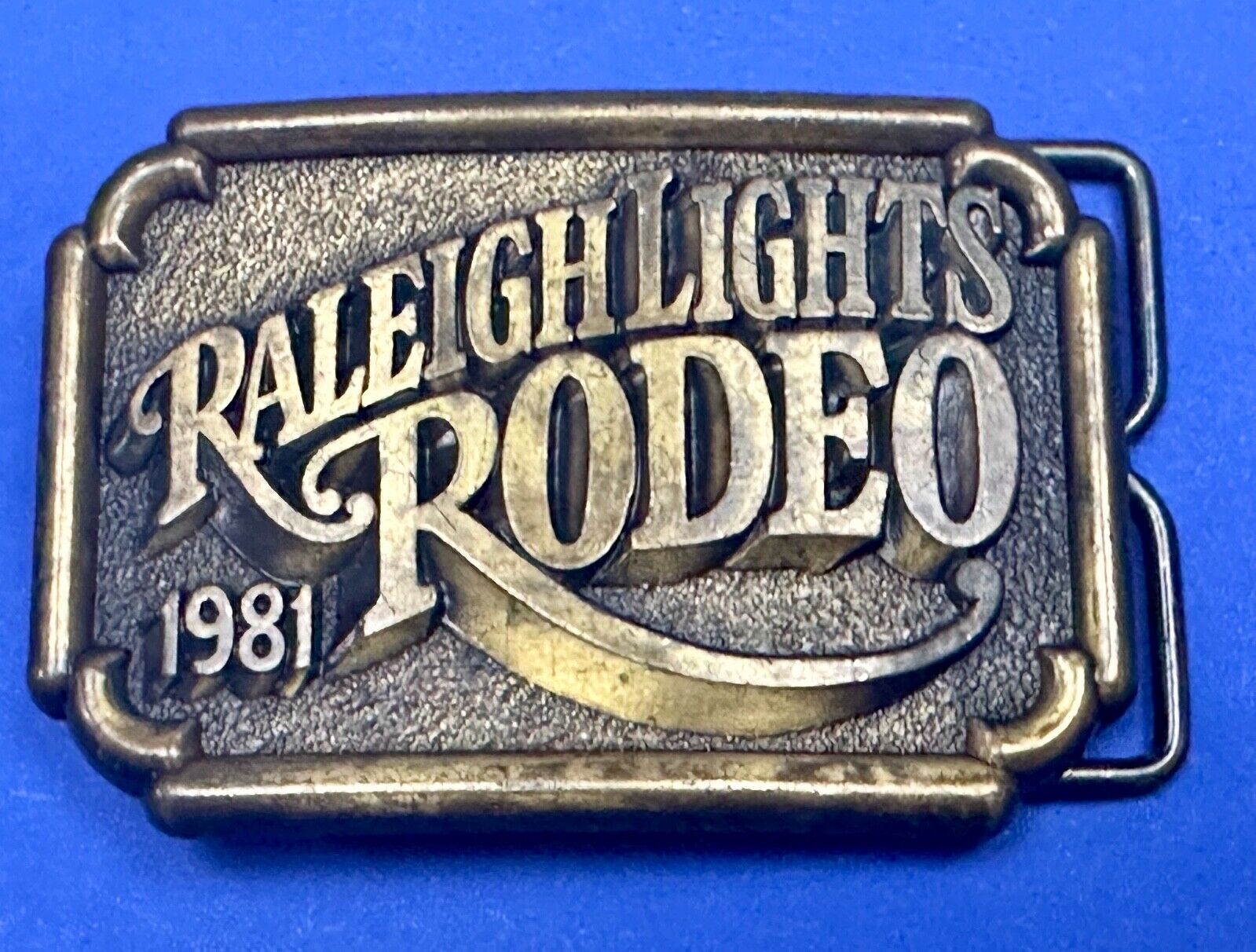 Vintage 1981 Raleigh Lights Rodeo Brass Tone Belt Buckle Advertising Cigarettes