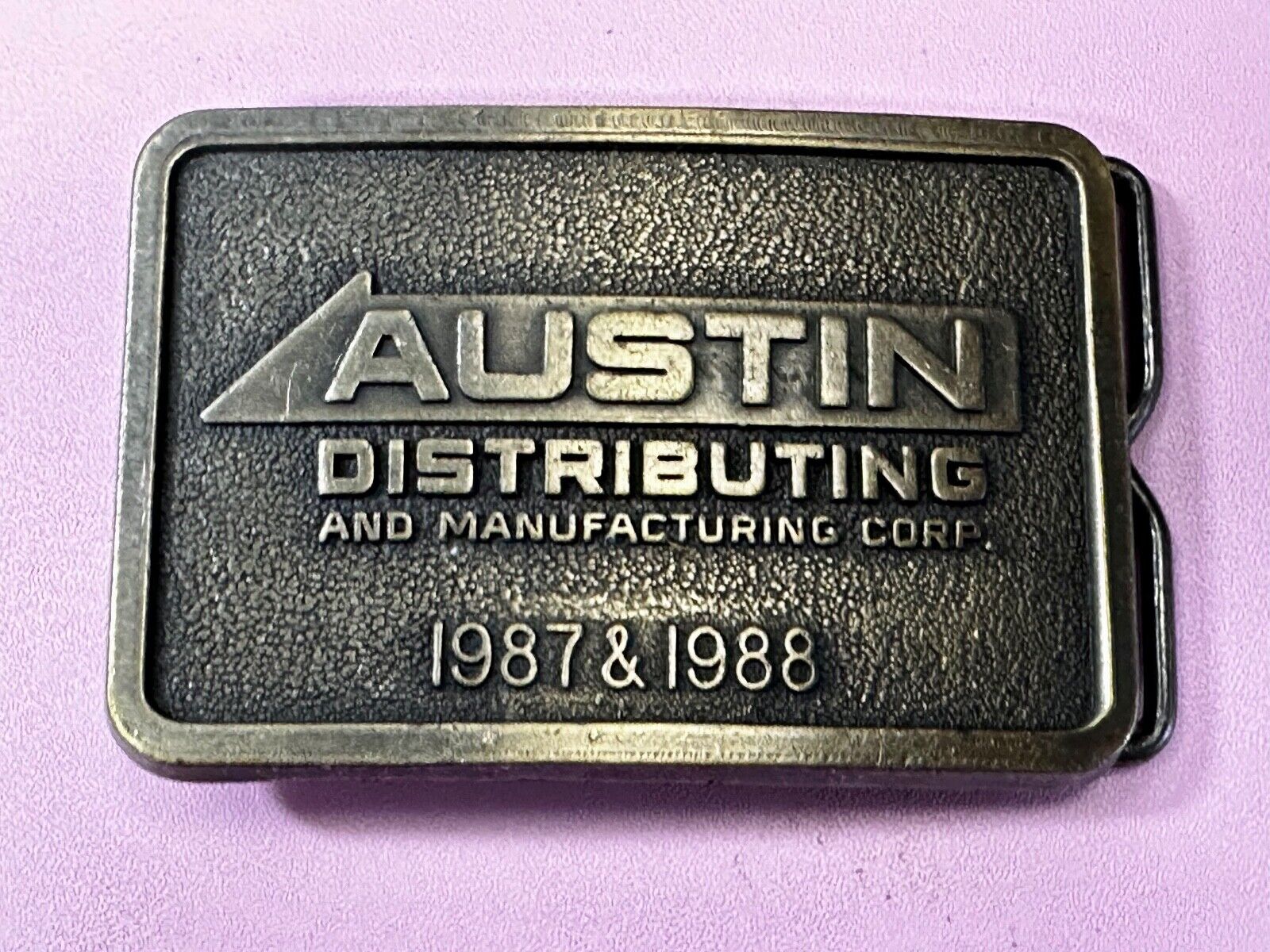 Austin Texas Distributing and Manufacturing 1987 Advertisement Promo Belt Buckle