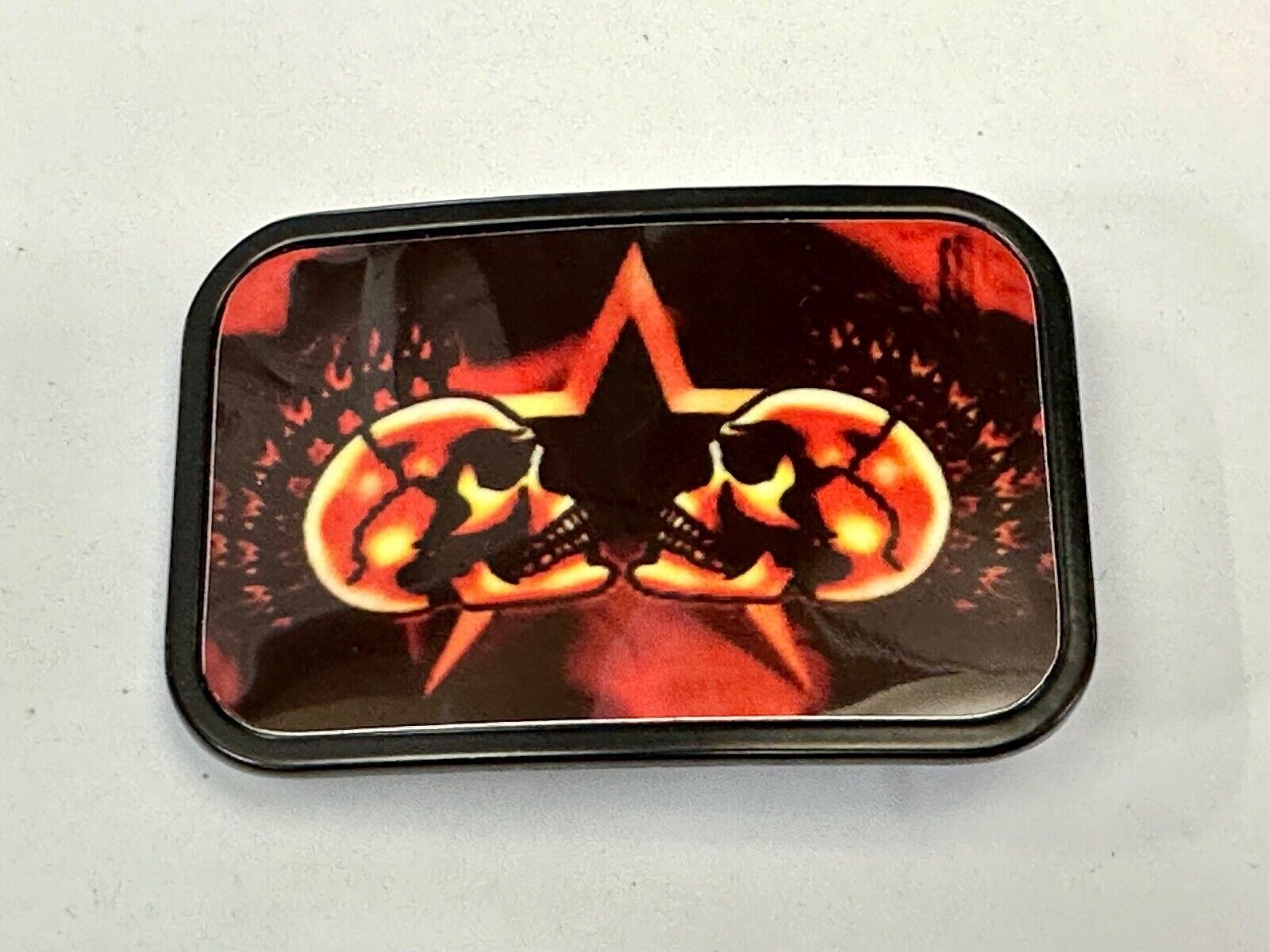 Two Skulls around star picture - black & red color rectangular belt buckle