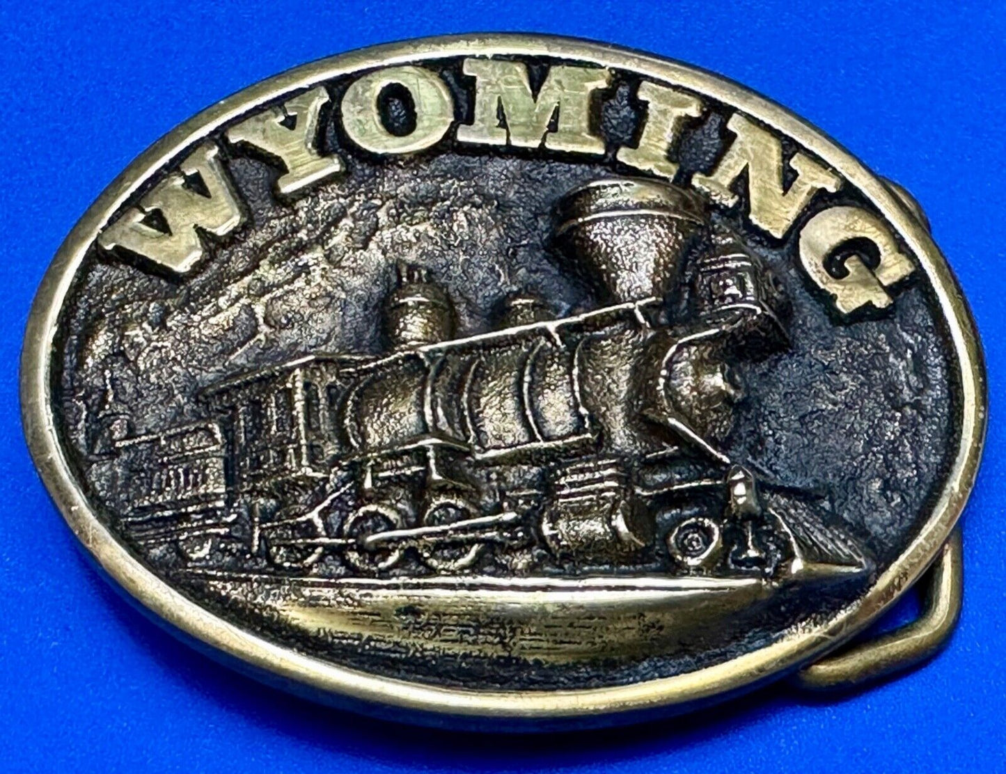 The great state of Wyoming Train History brass belt buckle by Heritage Mint LTD