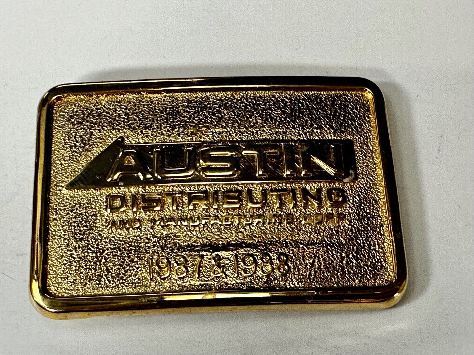 Austin Texas Distributing and Manufacturing 1987 Gold Tone Belt Buckle