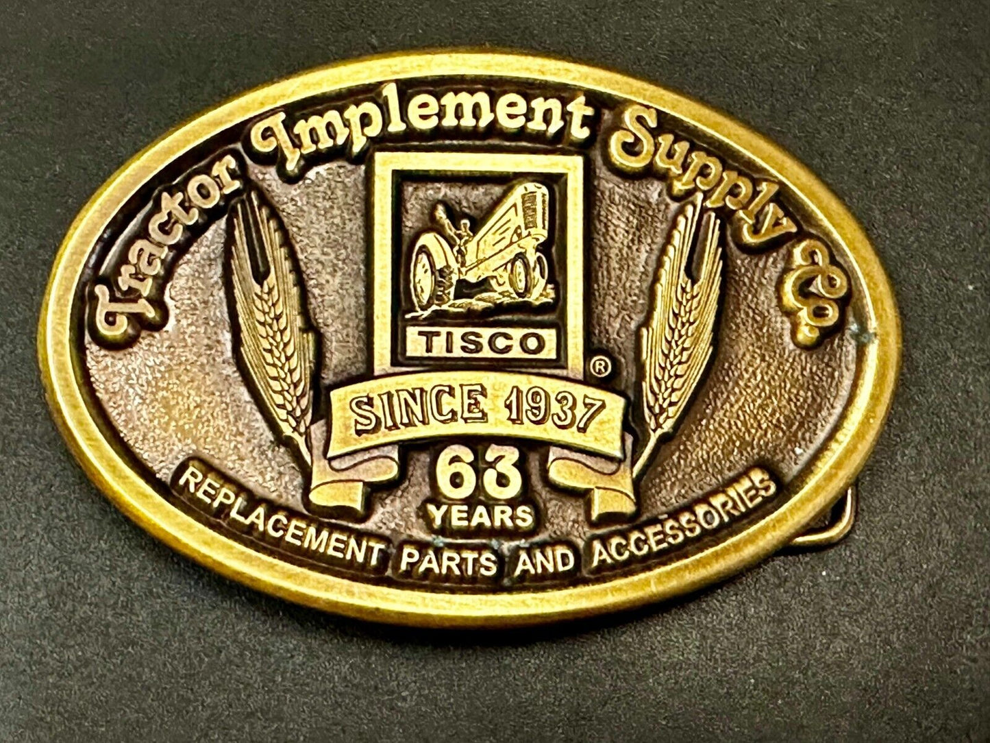 63 years TISCO Tractor Implement Supply company Vintage Belt Buckle by Speccast