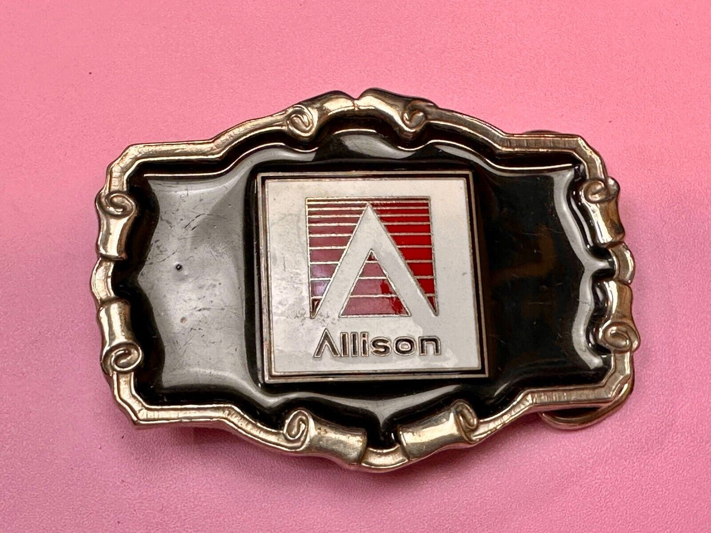 Allison Company logo emblem on western framed black enameled belt buckle