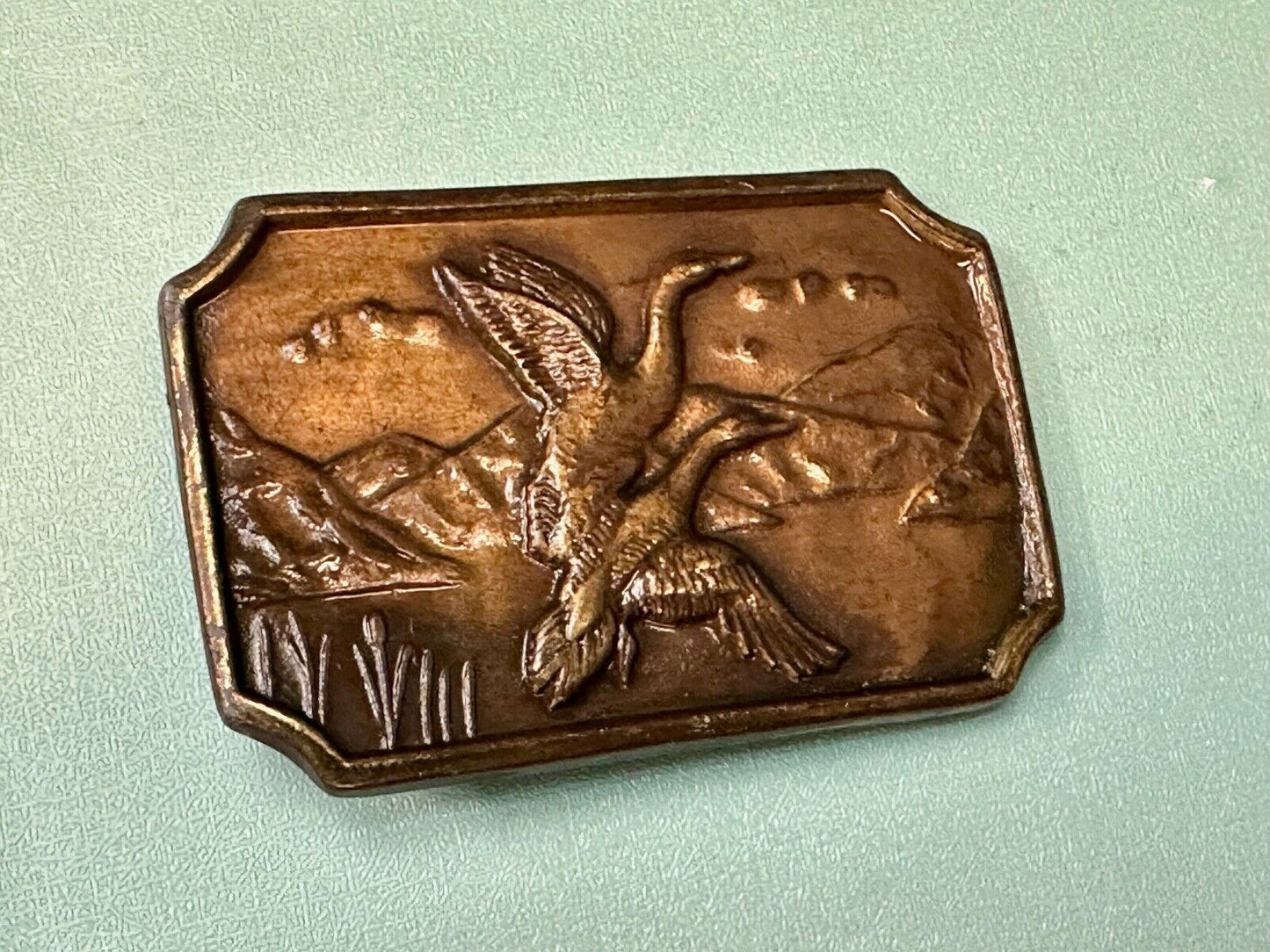 Two ducks flying from pond - Vintage nature scene belt buckle