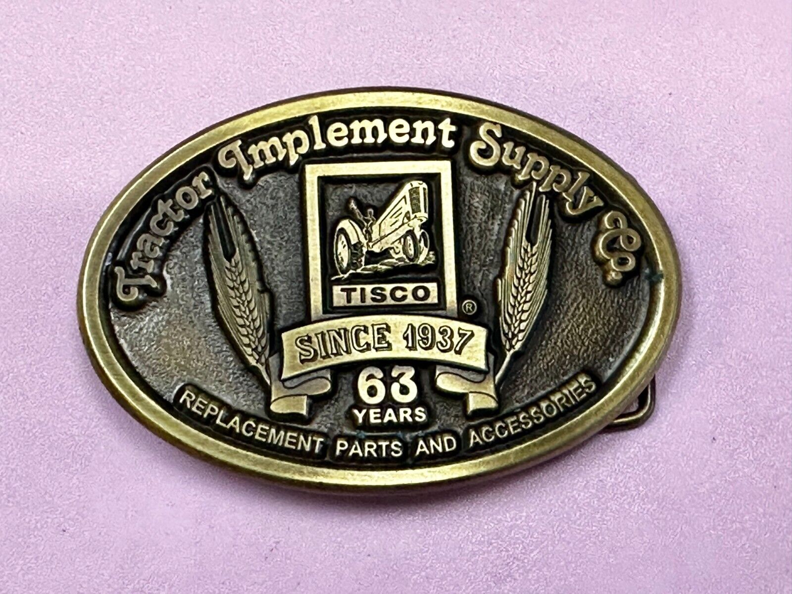 63 years TISCO Tractor Implement Supply company Vintage Belt Buckle by Speccast