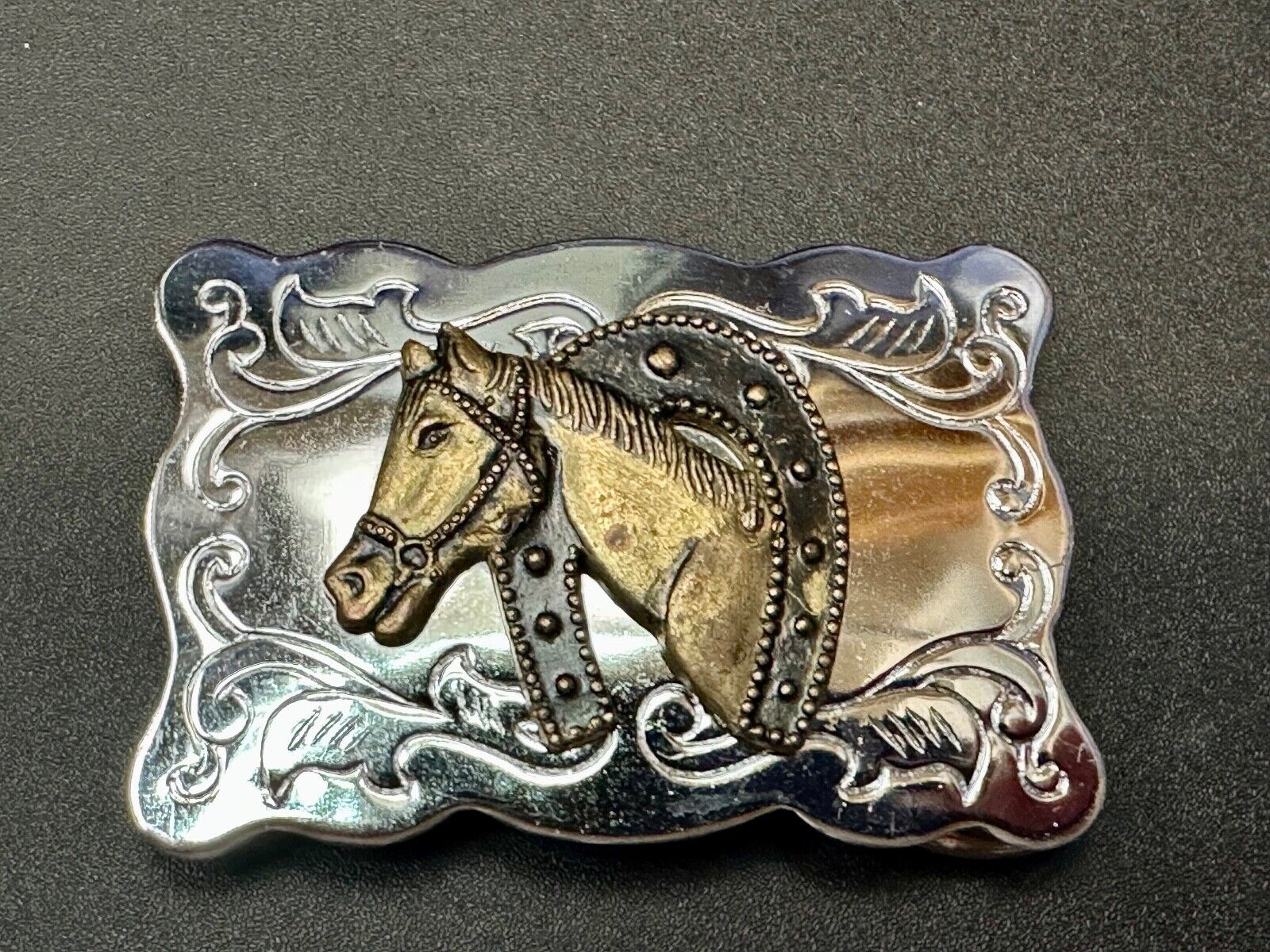 Vintage lucky horseshoe with head centerpiece on western two tone belt buckle