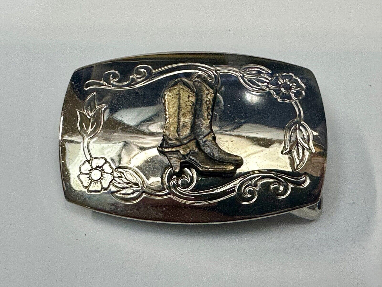 USA made Western Cowboy boots on reflective two tone vintage belt buckle