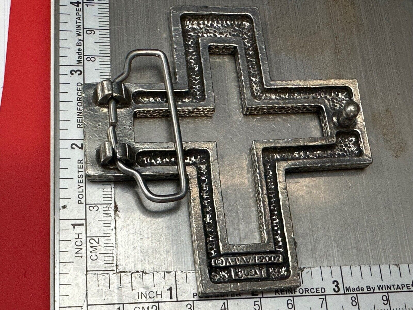 A.P.W. 2007 cross cutout silver tone belt buckle