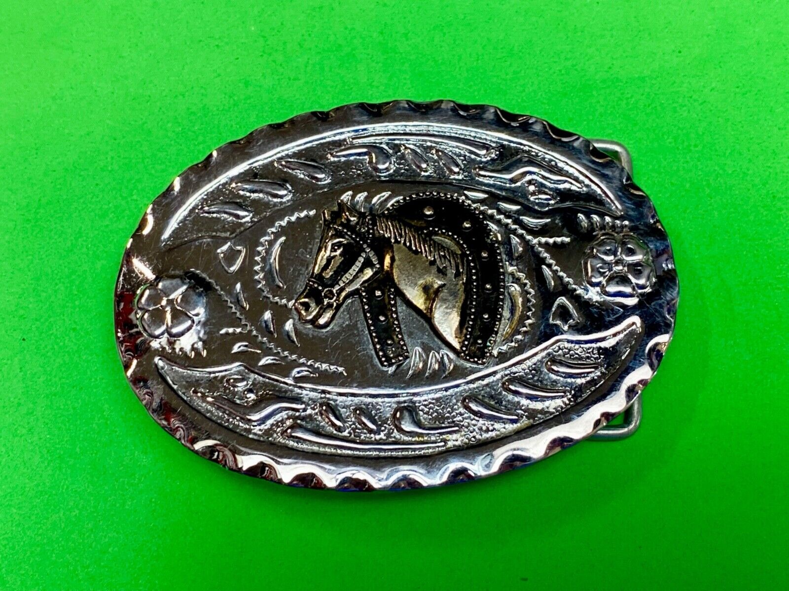 Vintage horse head through lucky horseshoe on mixed metal western belt buckle