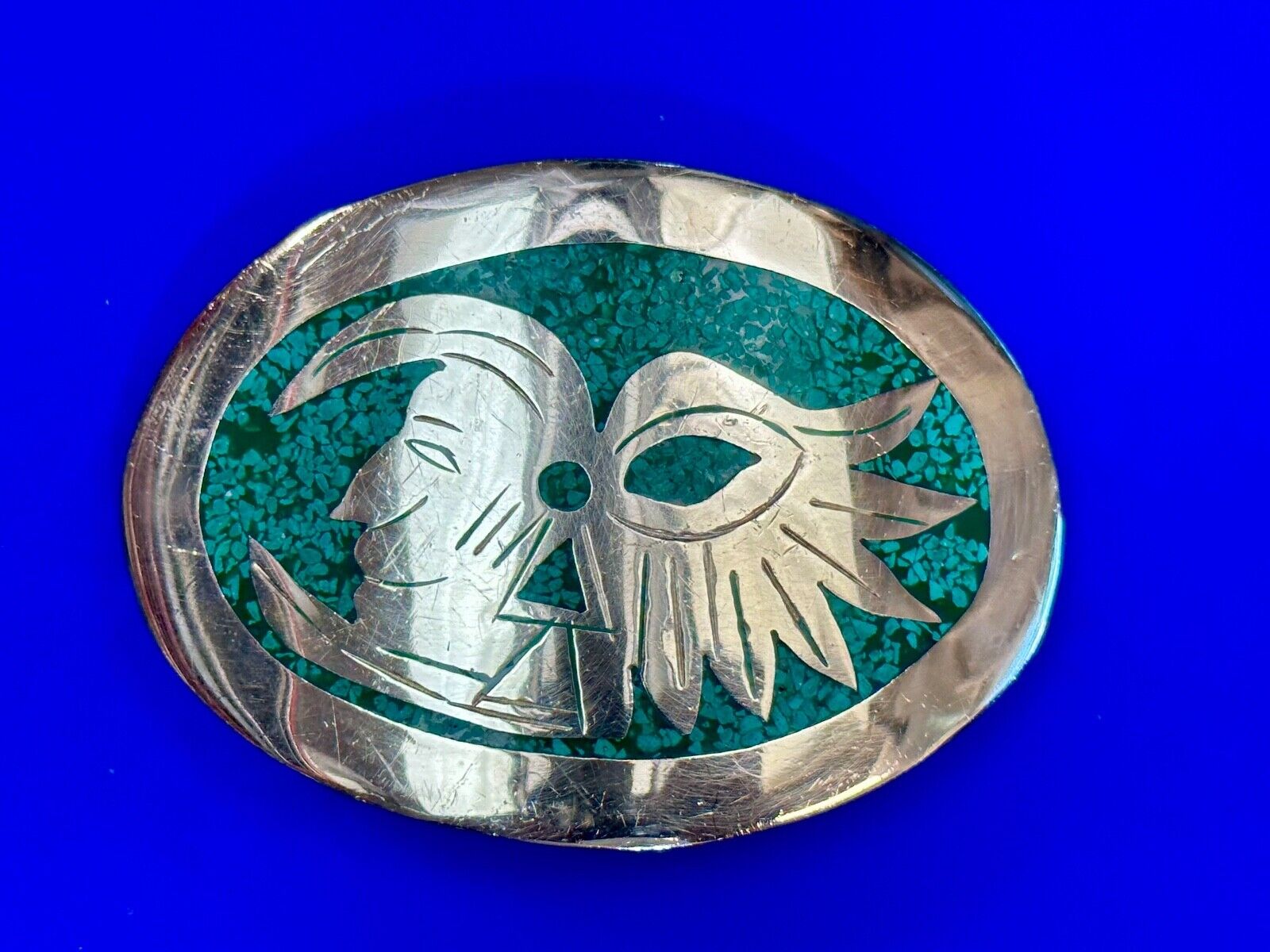 Tribal Face - Inlaid Turquoise chip to Alpaca stamped oval Belt Buckle