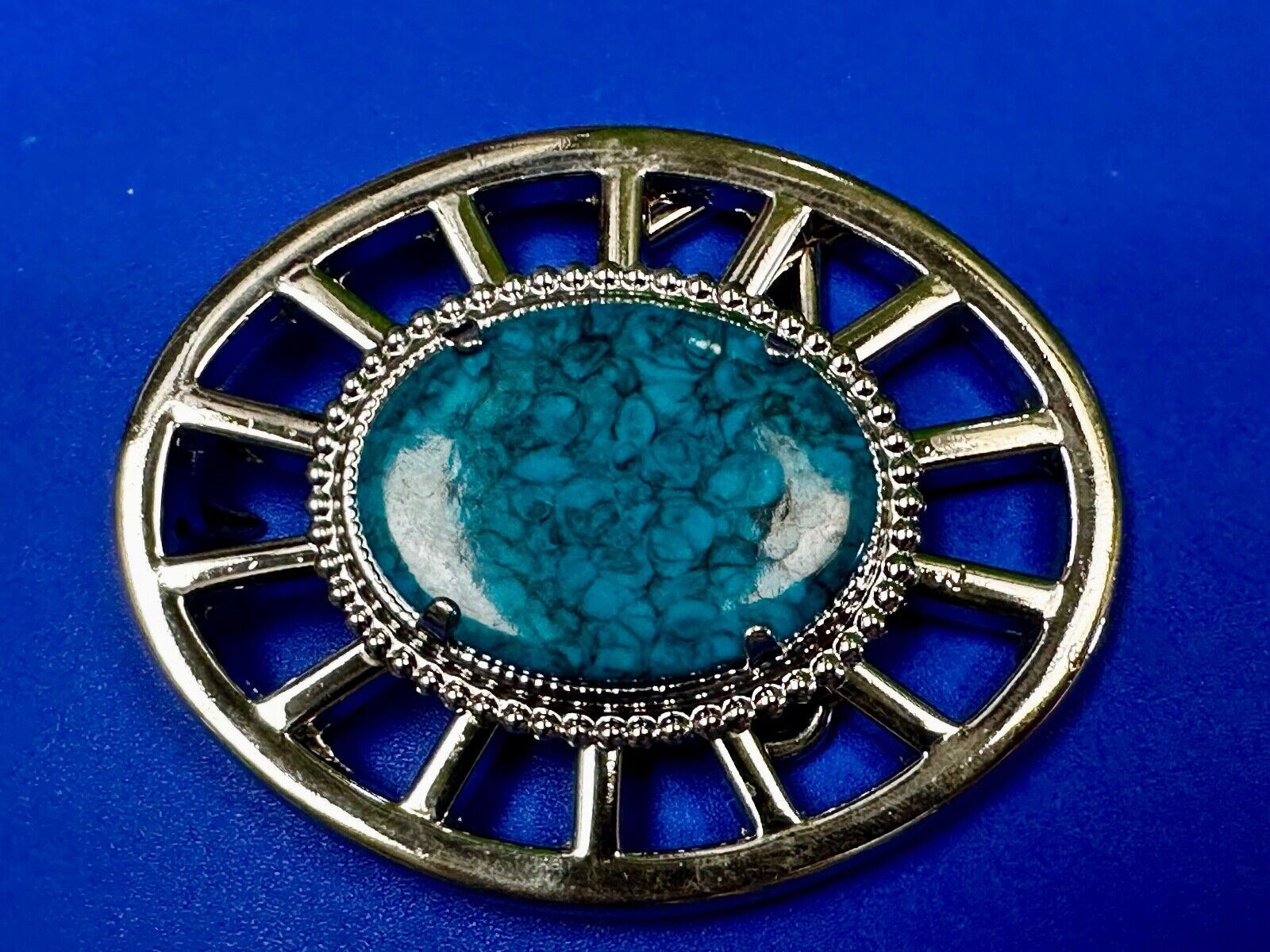 Synthetic Turquoise in unique see through silver tone round Belt Buckle