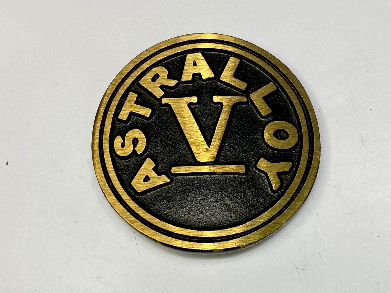 Astralloy Vis a unique, deep-air hardened steel promotional brass belt buckle 